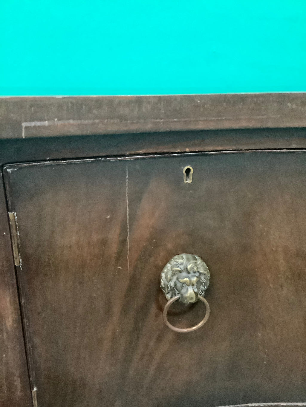 mahogany serpentine-front sideboard featuring distinct brass lion-mask ring pull handles 170826008