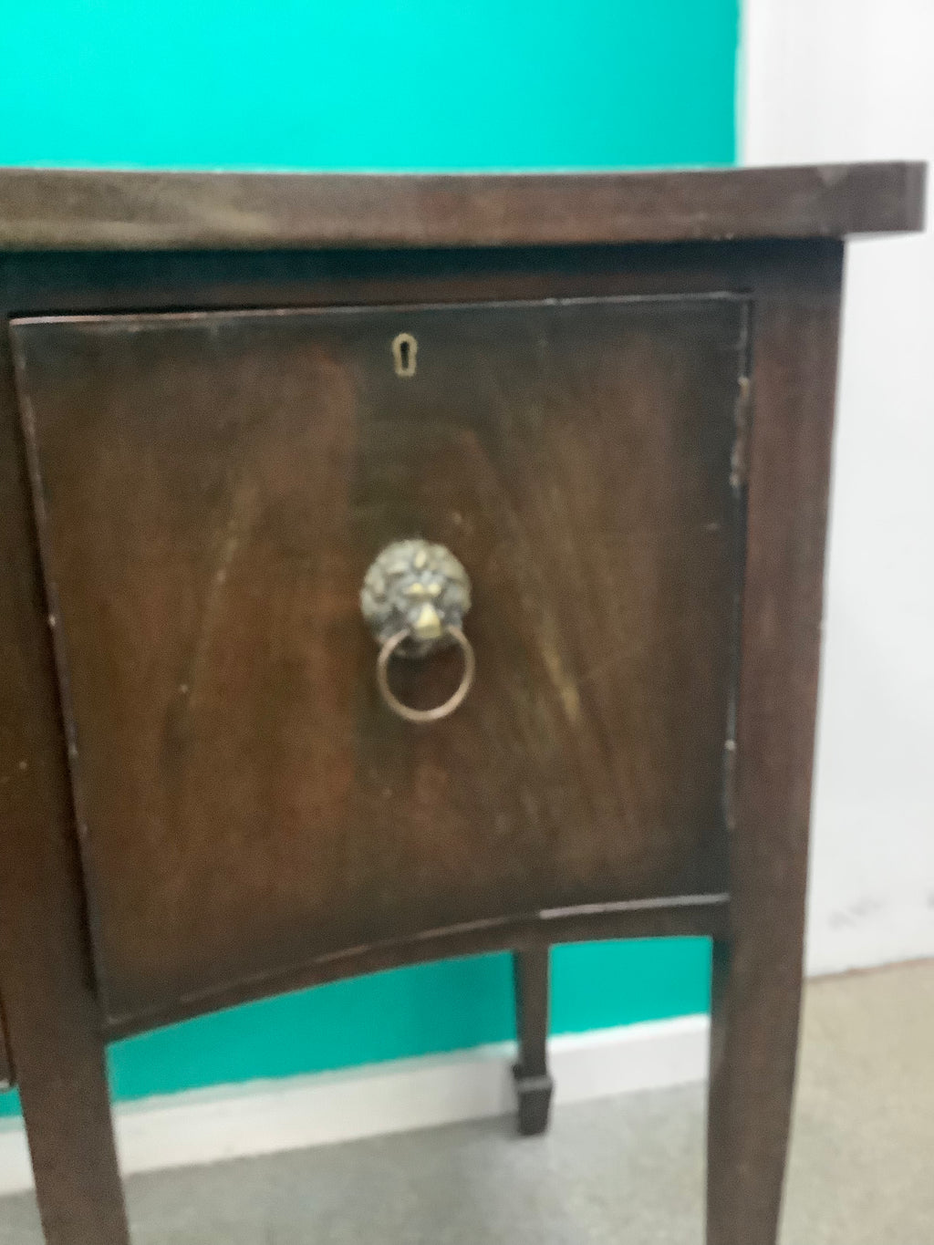 mahogany serpentine-front sideboard featuring distinct brass lion-mask ring pull handles 170826008