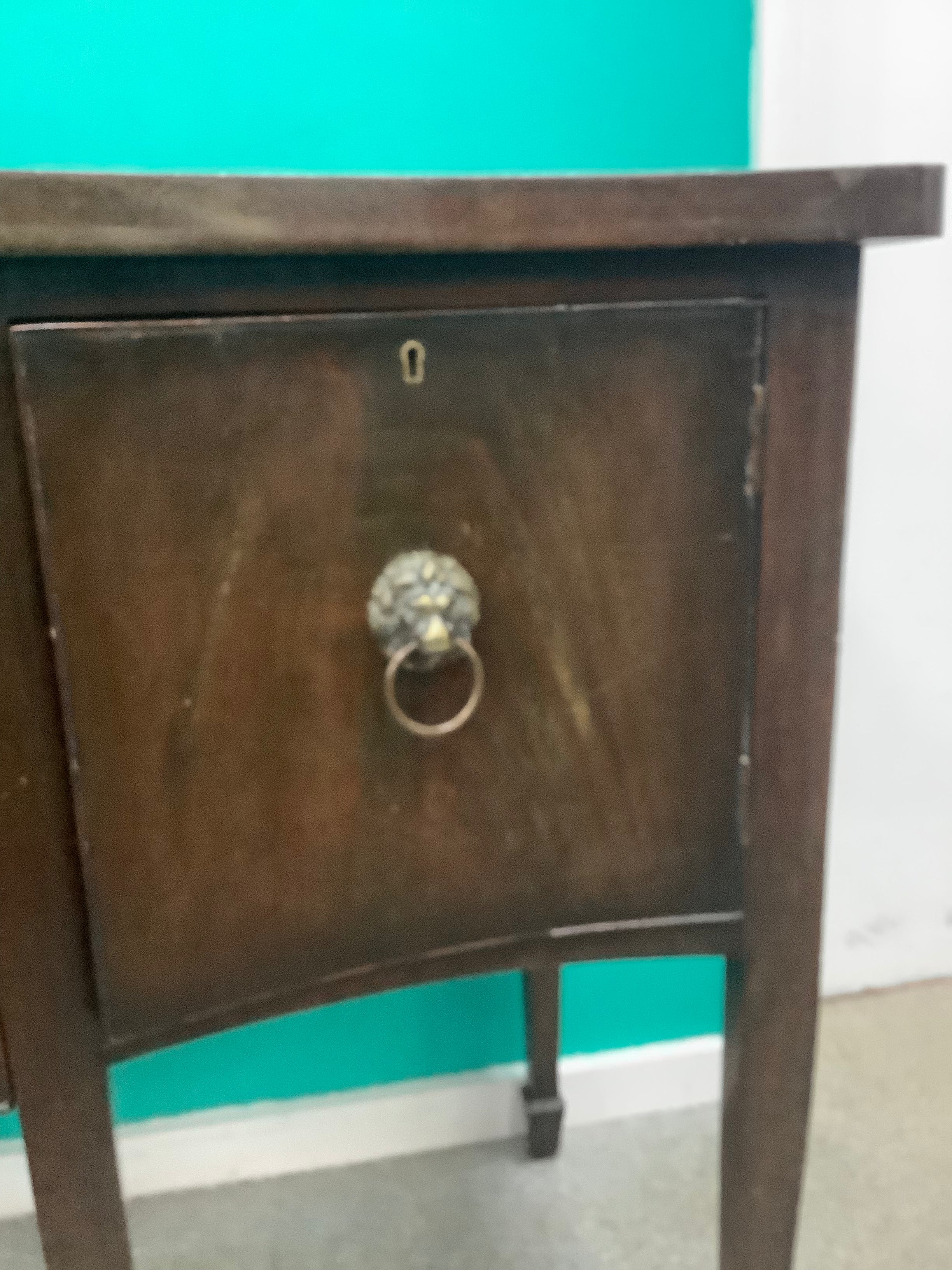 mahogany serpentine-front sideboard featuring distinct brass lion-mask ring pull handles 170826008