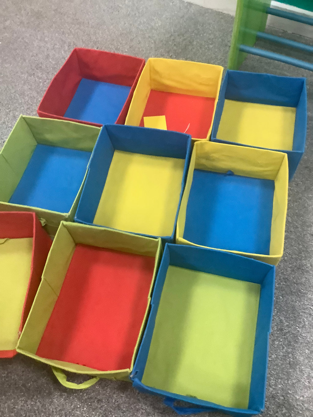 green 3-tier children's storage unit features nine colorful, removable fabric boxes with handle loops for organizing toys and books 190826002