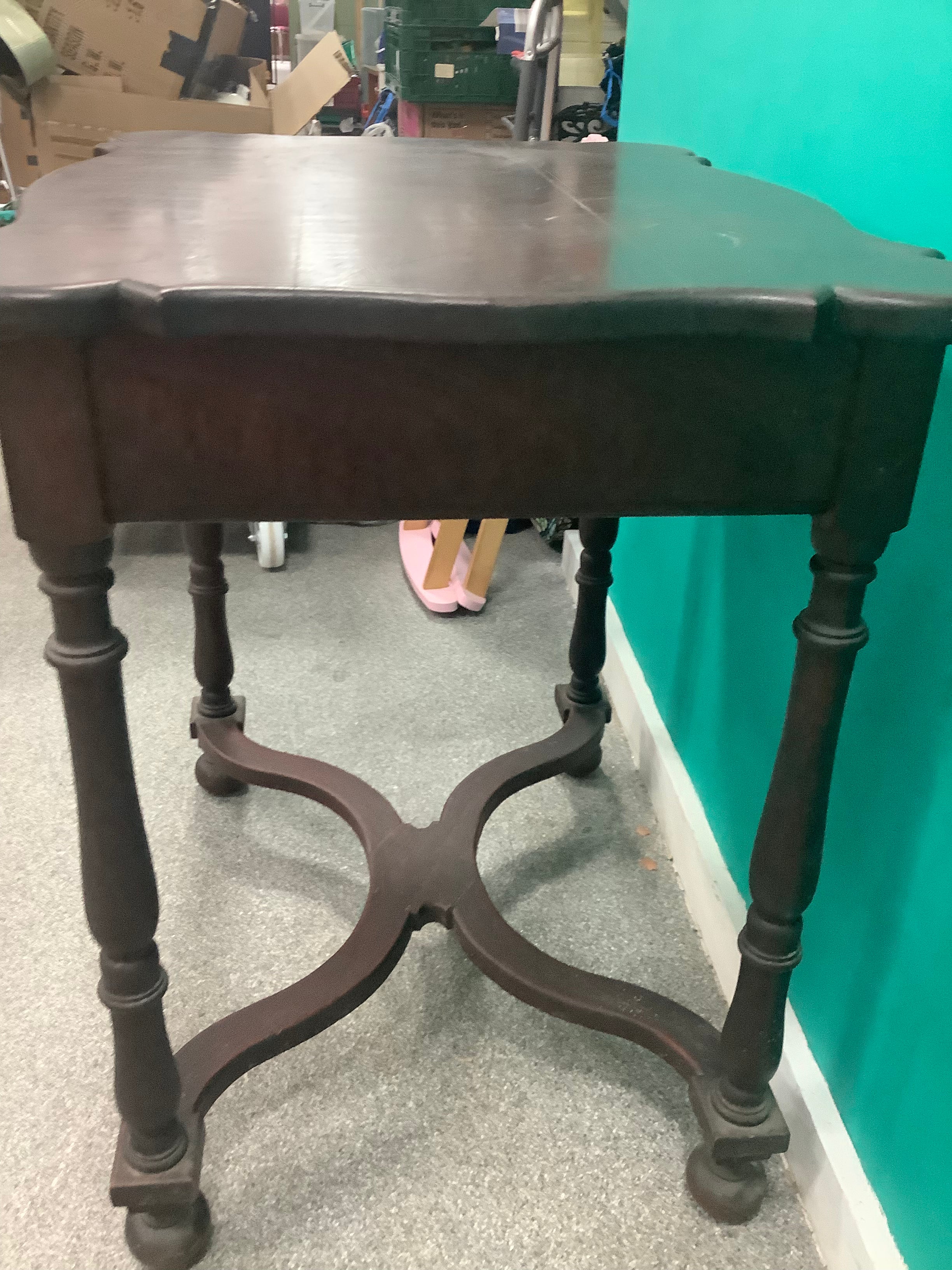 dark wood side table features a scalloped rectangular top, ring-and-baluster turned legs, and a serpentine X-stretcher base ending in ball feet 210826005