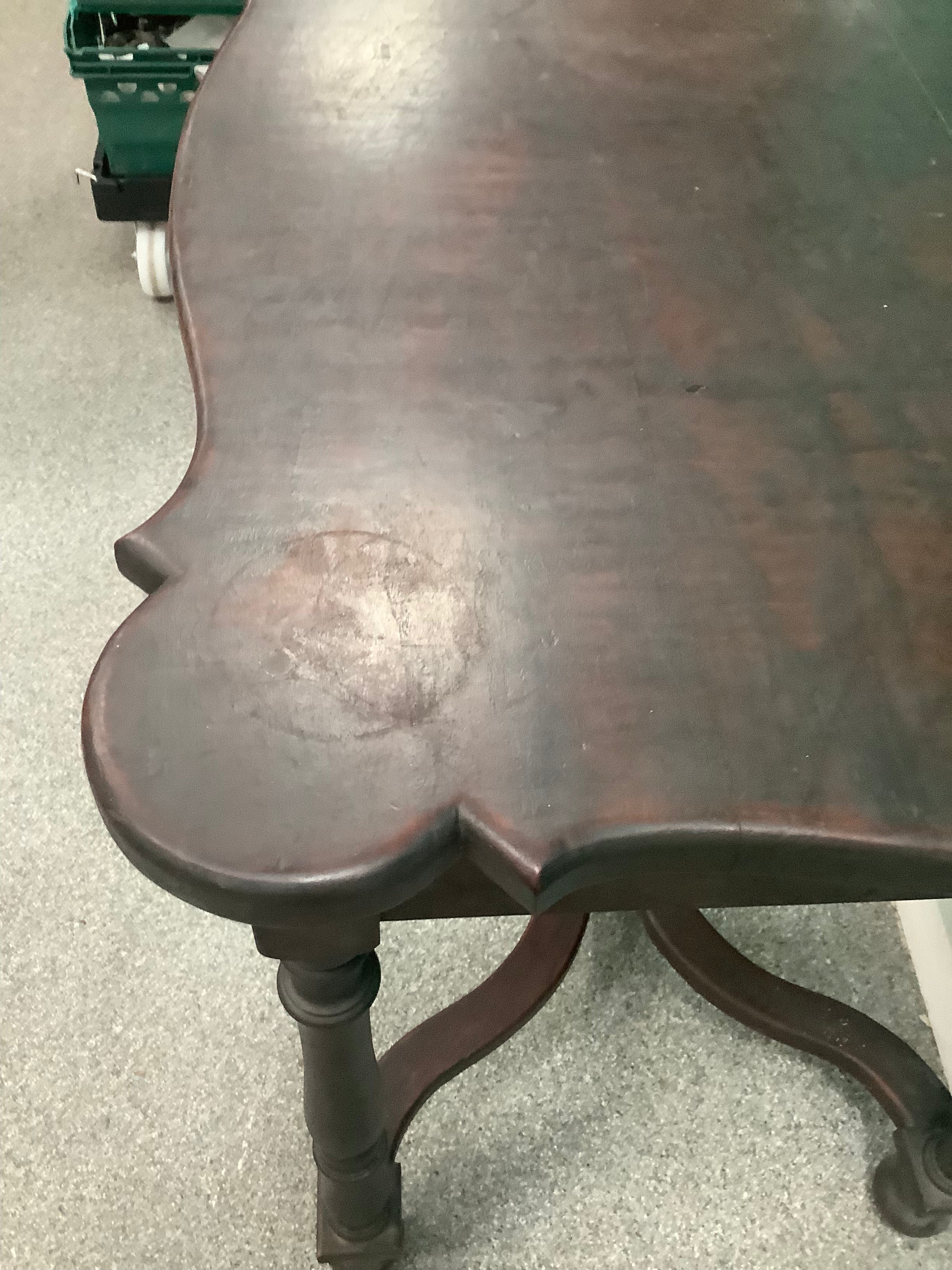 dark wood side table features a scalloped rectangular top, ring-and-baluster turned legs, and a serpentine X-stretcher base ending in ball feet 210826005