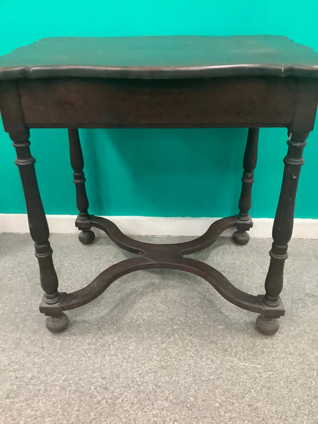dark wood side table features a scalloped rectangular top, ring-and-baluster turned legs, and a serpentine X-stretcher base ending in ball feet 210826005