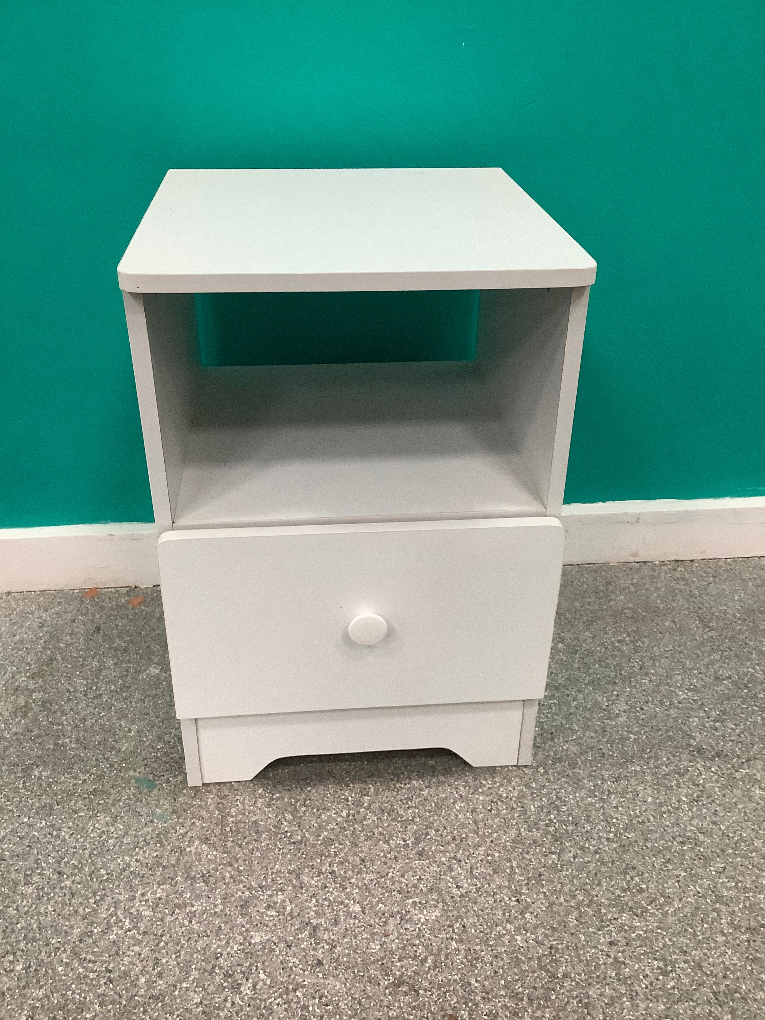 white wooden bedside table features a single pull-out drawer with a round knob and an open upper storage shelf. 240826002