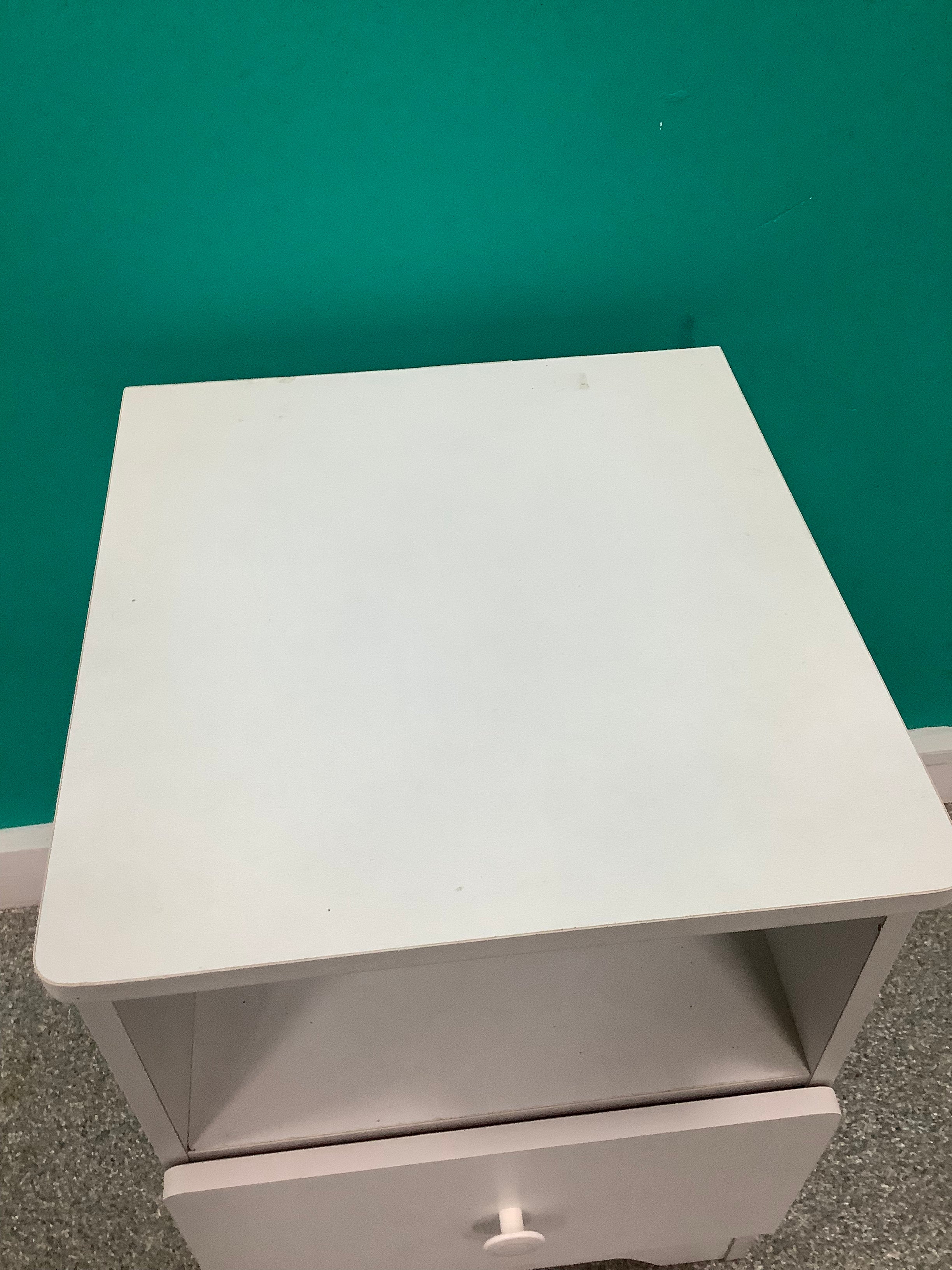 white wooden bedside table features a single pull-out drawer with a round knob and an open upper storage shelf. 240826002